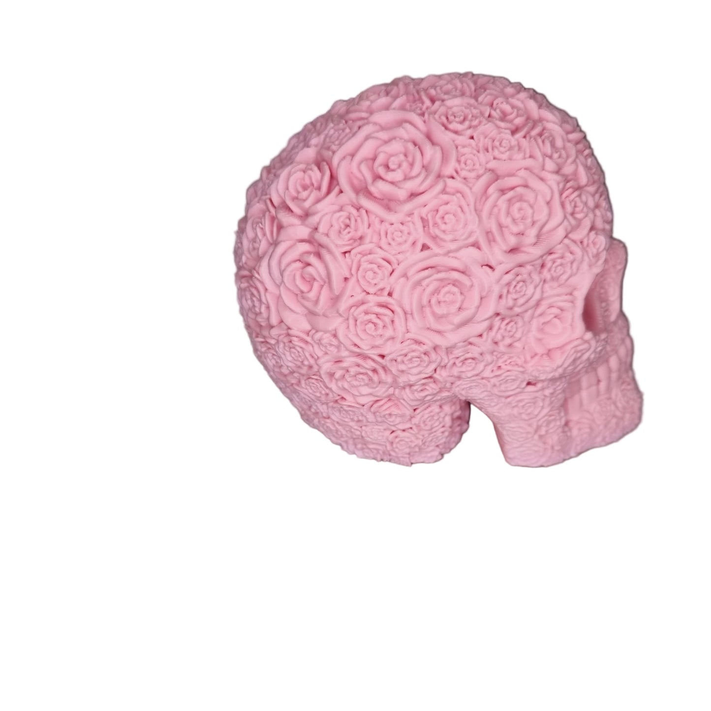 Pink skull-shaped object with floral patterns. Halloween or home decoration
