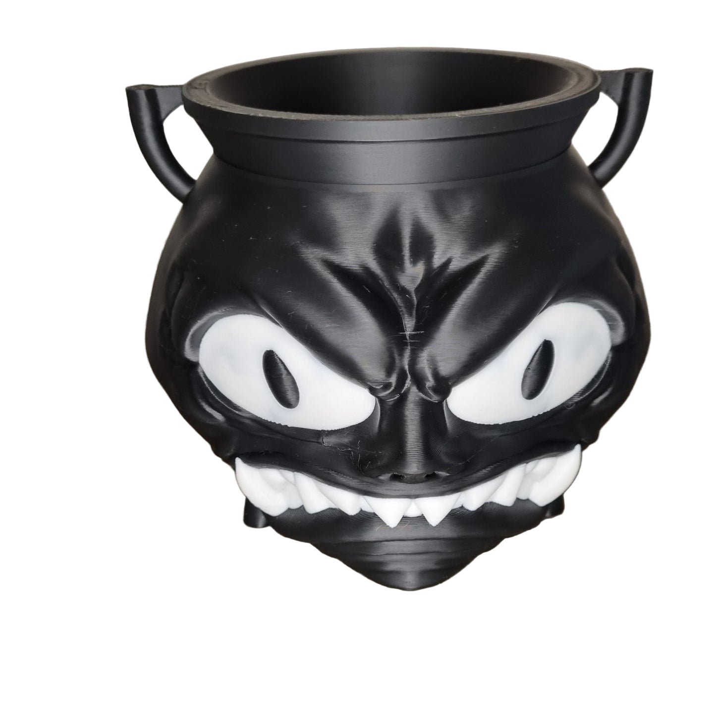 Black and white spooky cauldron with angry face