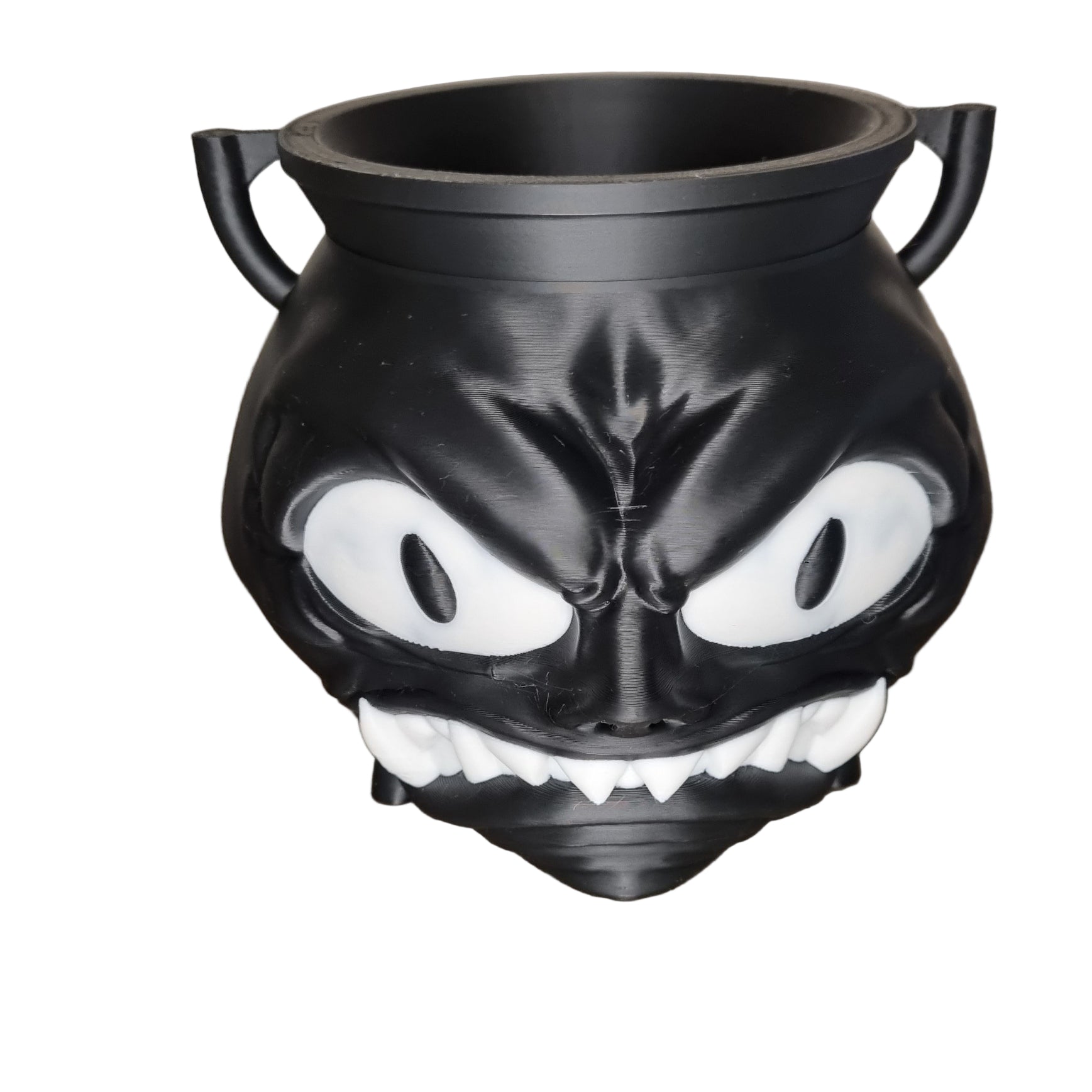 Black and white spooky cauldron with angry face