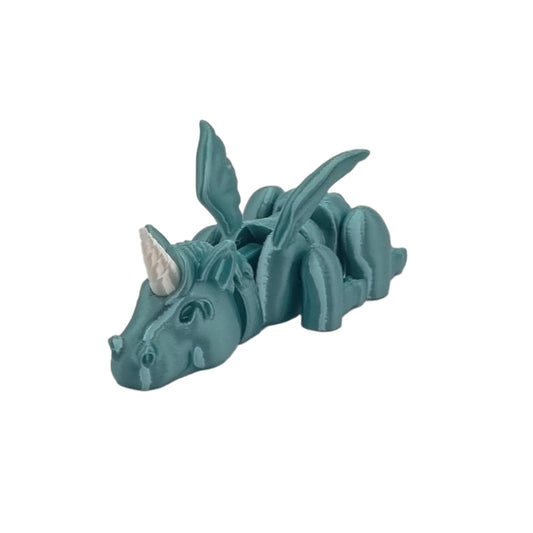 Sleepy Unicorn Articulated Series, front view, laid down